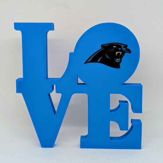 Blue 'LOVE' sign with a panther logo on a white background