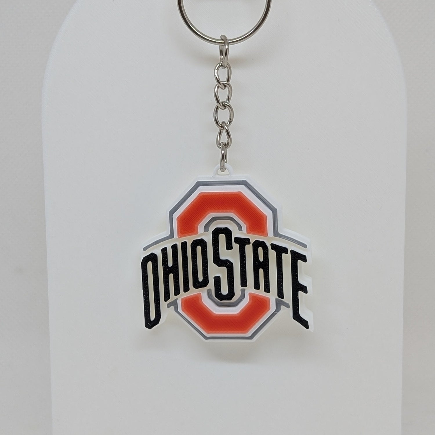 Ohio State keychain on a white display stand