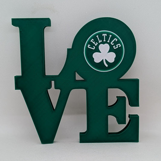 Celtics Green 'LOVE' sign with Celtics logo on a white background