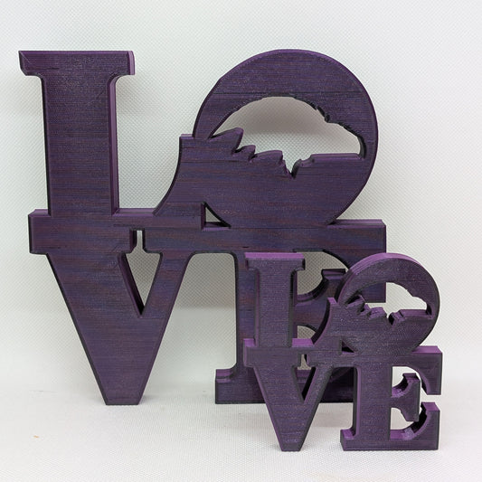 Purple 'LOVE' decorative letters on a white background