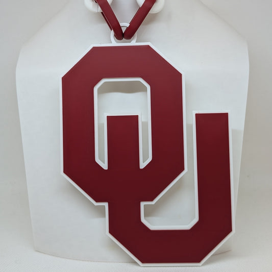White paper bag with a red 'OU' logo on a white background