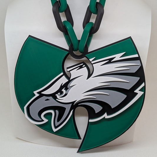 Green and black keychain with an eagle logo on a white background