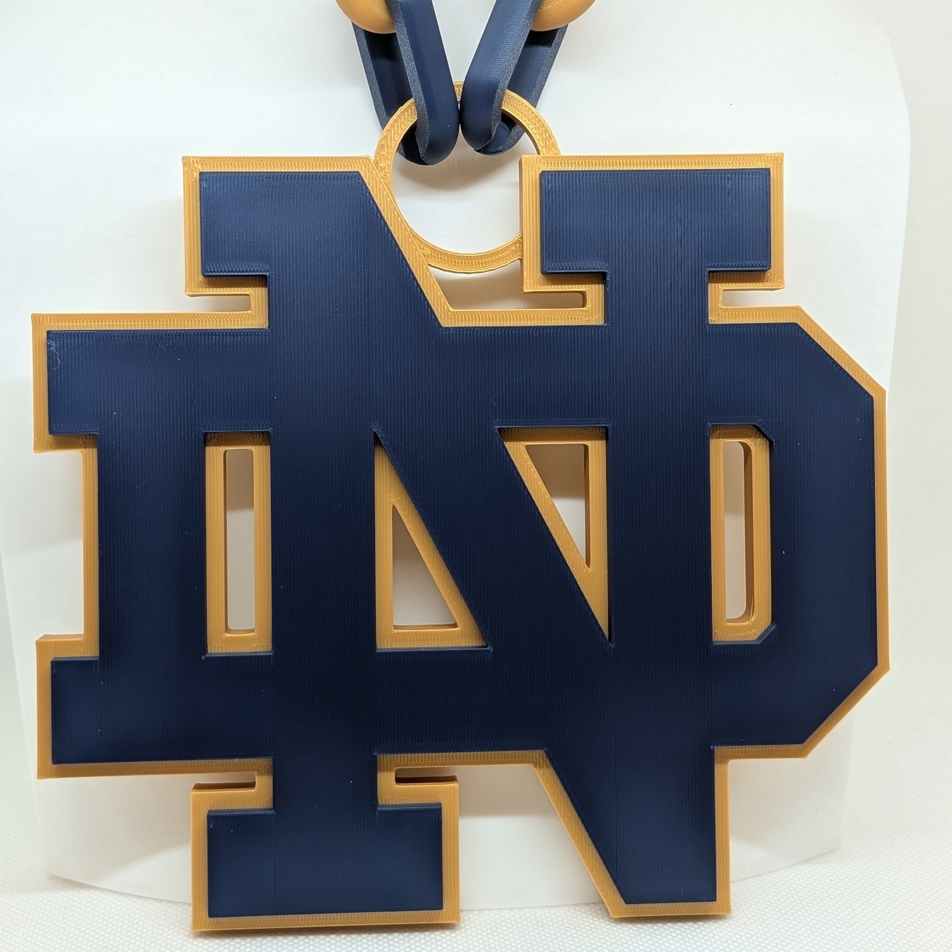 Blue and gold 'ND' logo on a white background