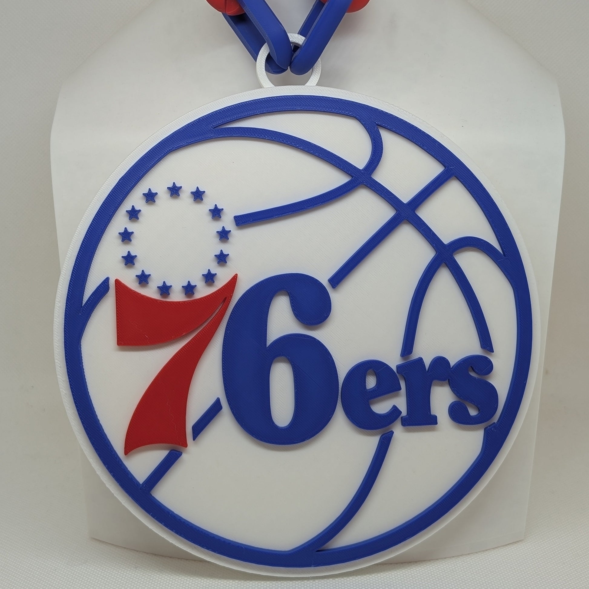76ers logo on a white background with red and blue accents