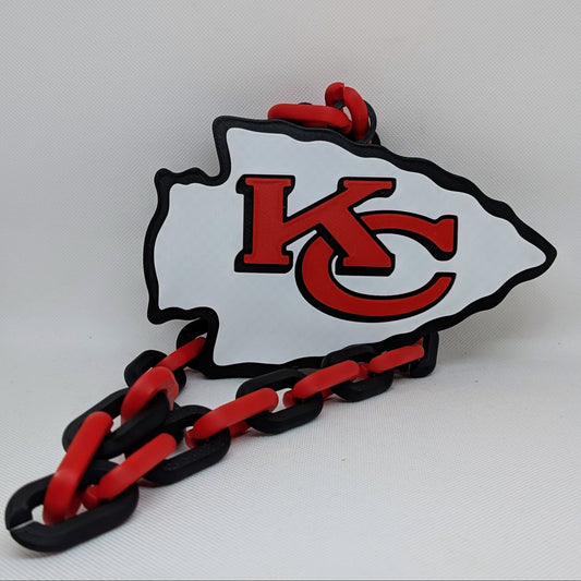 KC logo with red and black chain on a white background
